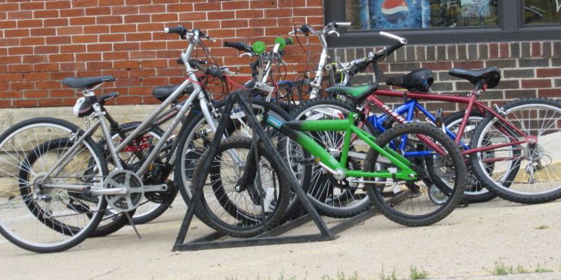 Group of bikes parked on bike rack