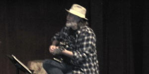 Dale Beeks playing guitar in Balderdash Ditty