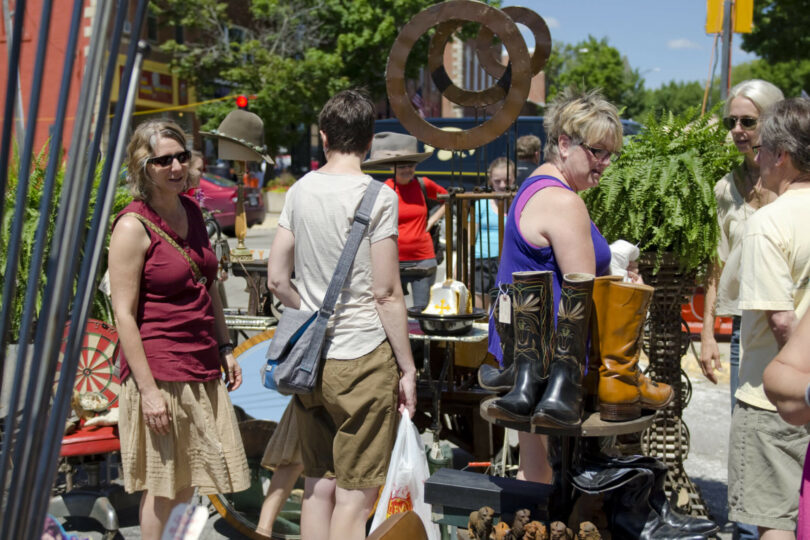 people talking at the outdoor antique festival