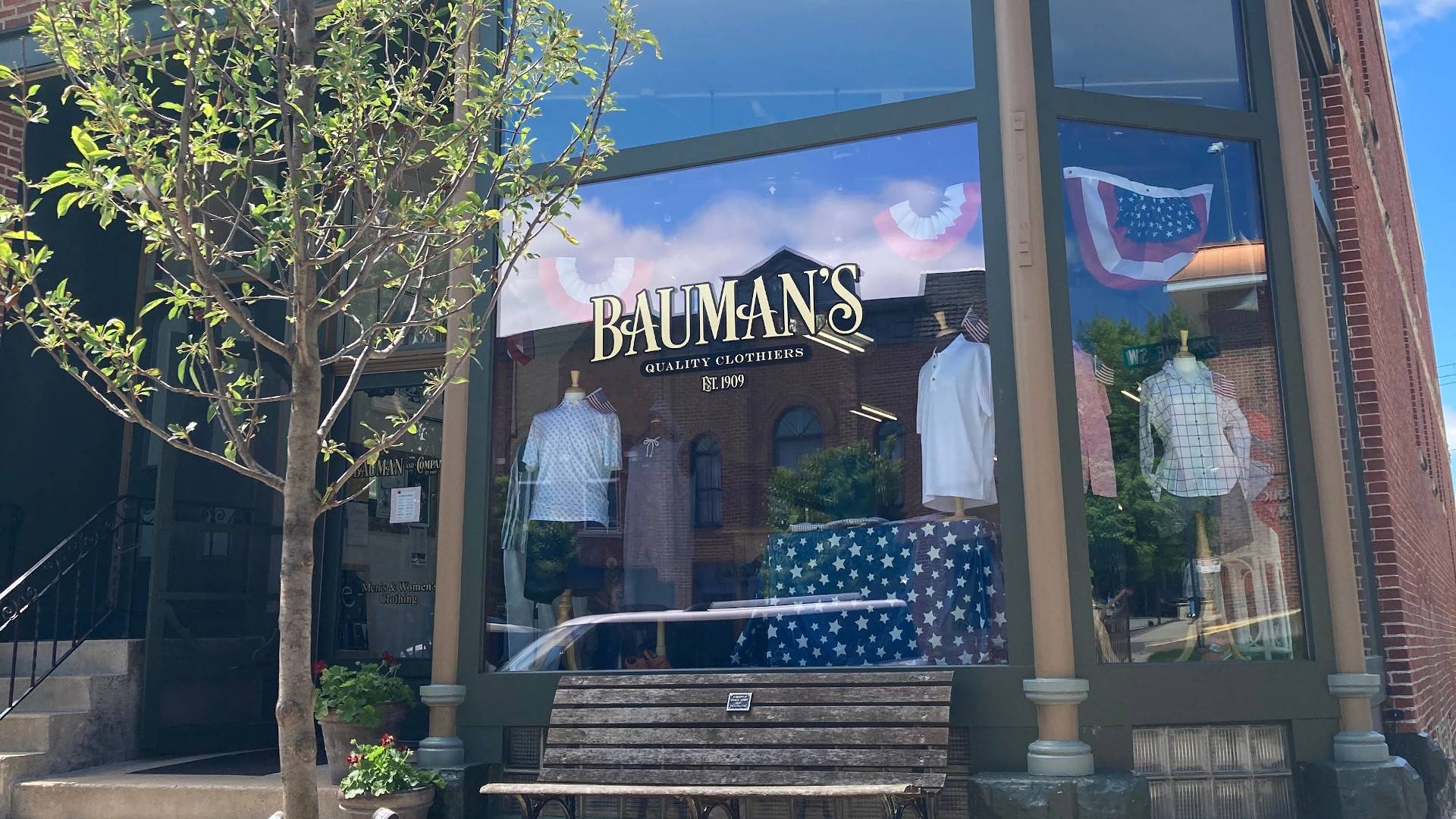 Storefront window and main street entrance to Bauman & Co Quality Clothiers