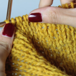 Knitting with yellow yarn