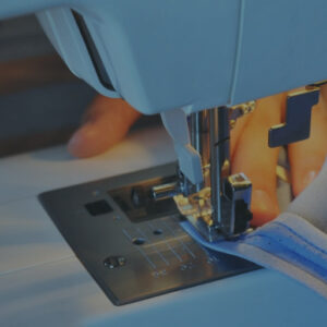 blue sewing machine sewing zipper