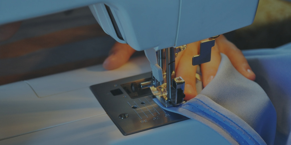 blue sewing machine sewing zipper