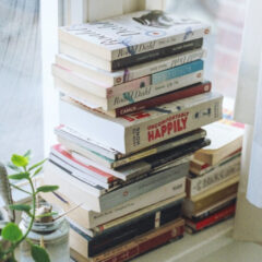 Stack of books by window