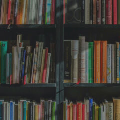 shelves of colorful books in a library