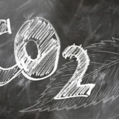 Black chalkboard with CO2 written in white block letters